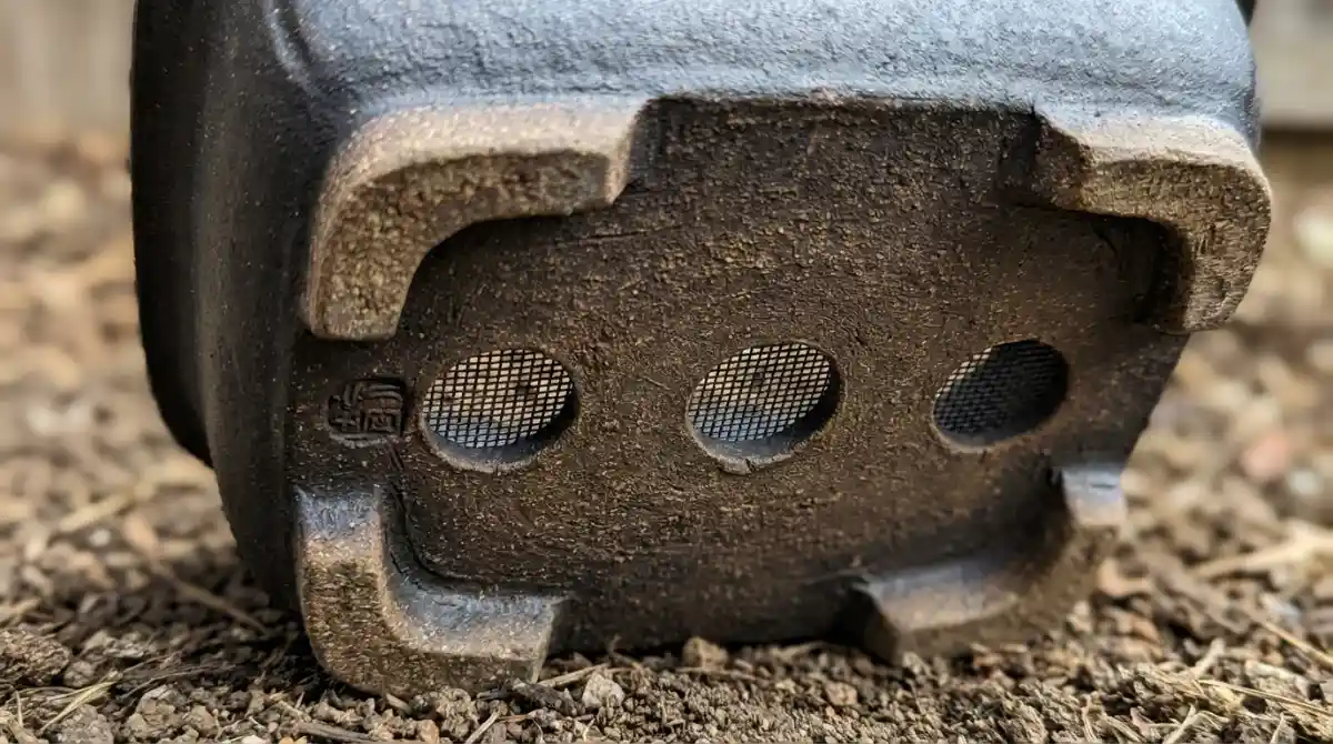 Excellent drainage holes and pot feet on a bonsai pot, crucial for NZ natives